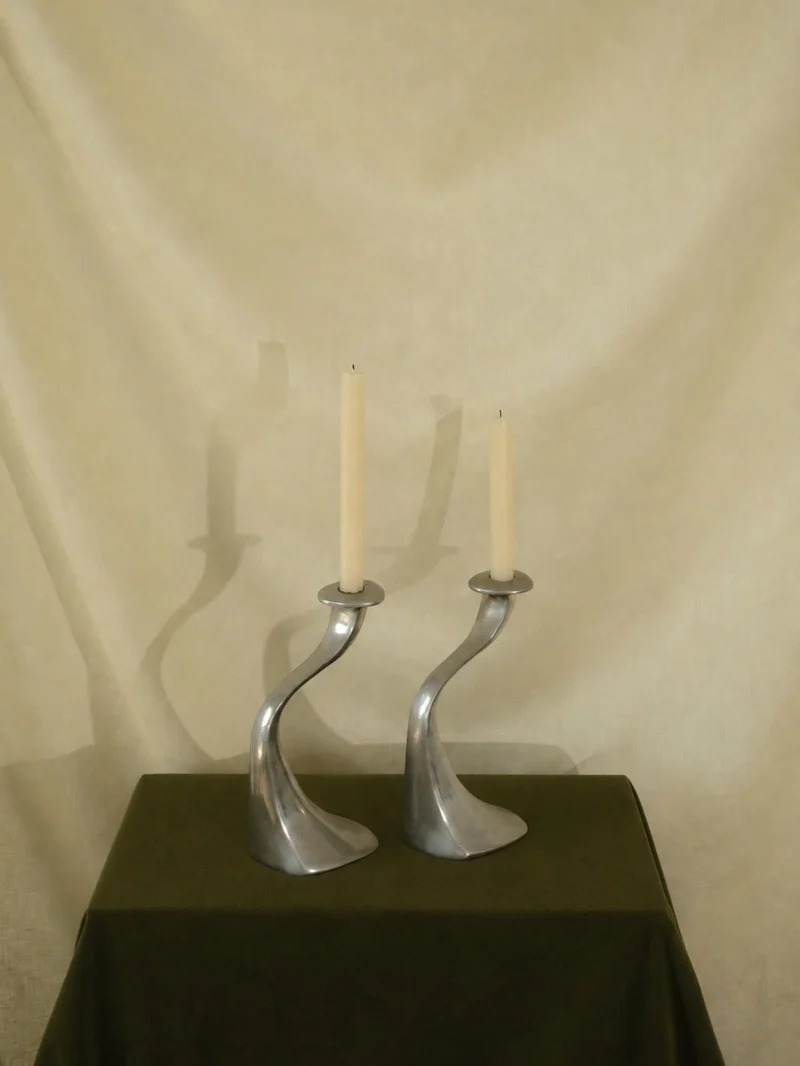 A Sculptural Set of 2 Inox Candle Holders