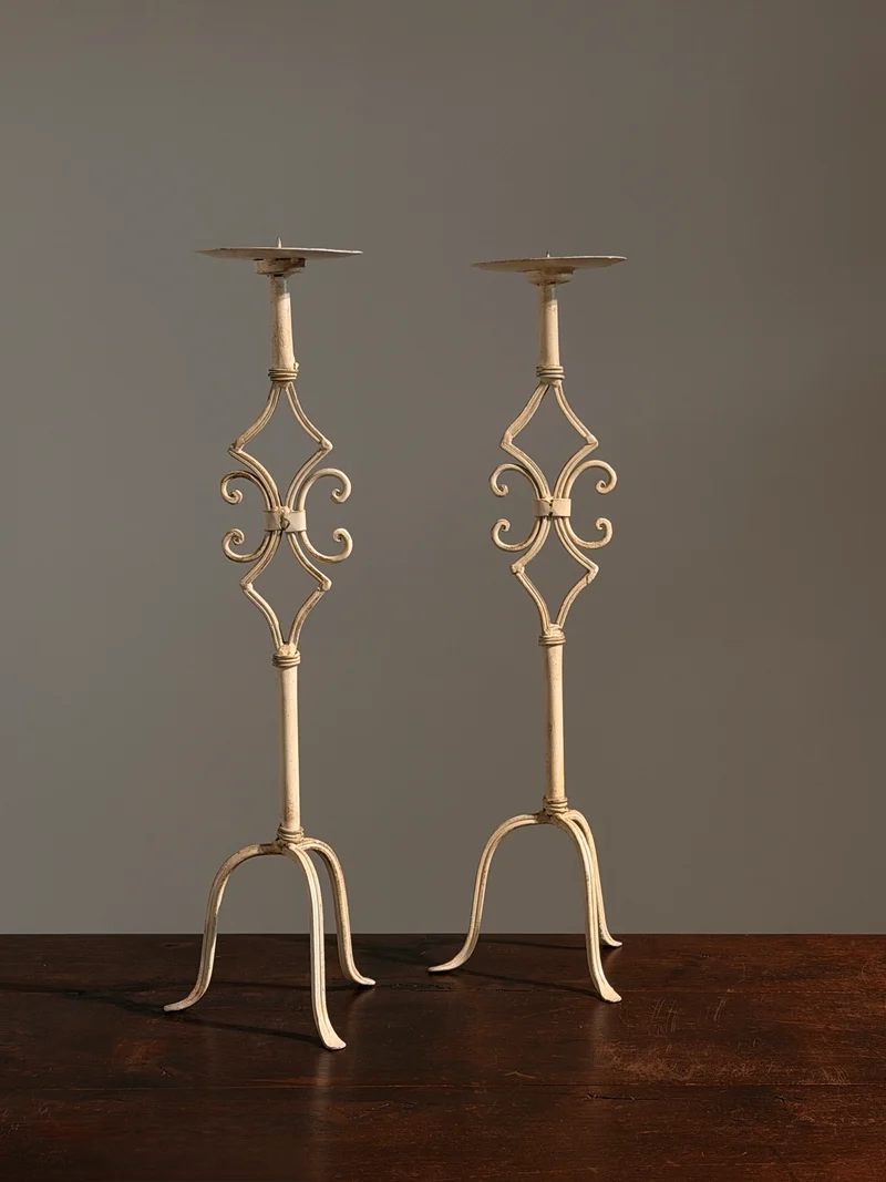 Pair of large cream-painted wrought-iron pricket candlesticks, Italy