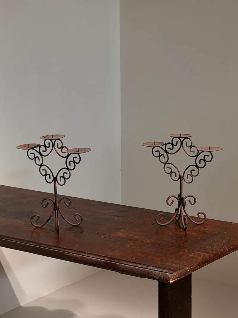 Pair of three-light wrought-iron candleholders, circa 1950