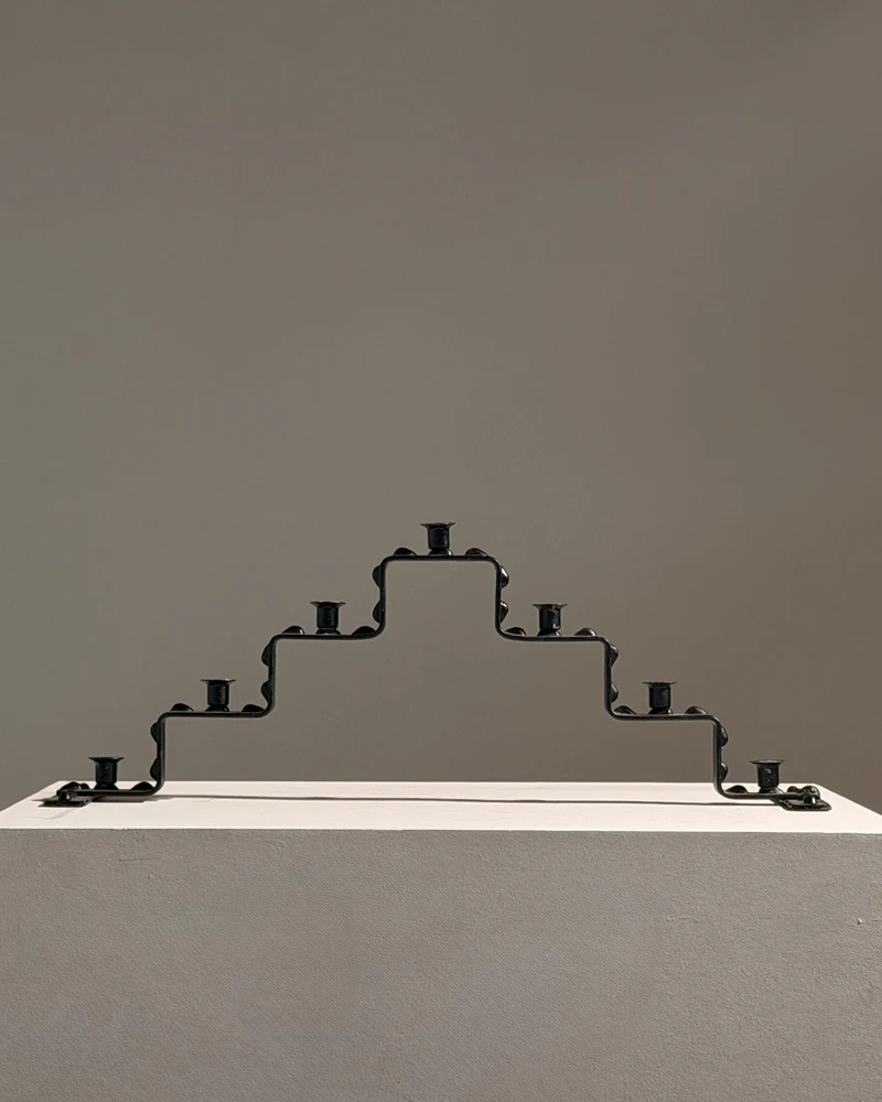 Seven-light geometric candelabra in black iron, circa 1960