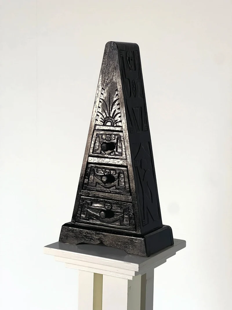 Triangle small chest of carved drawers
