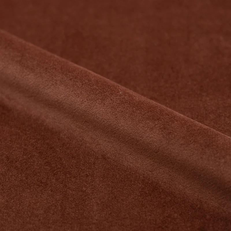 Fauteuil pivotant Ysé en velours rouge brique